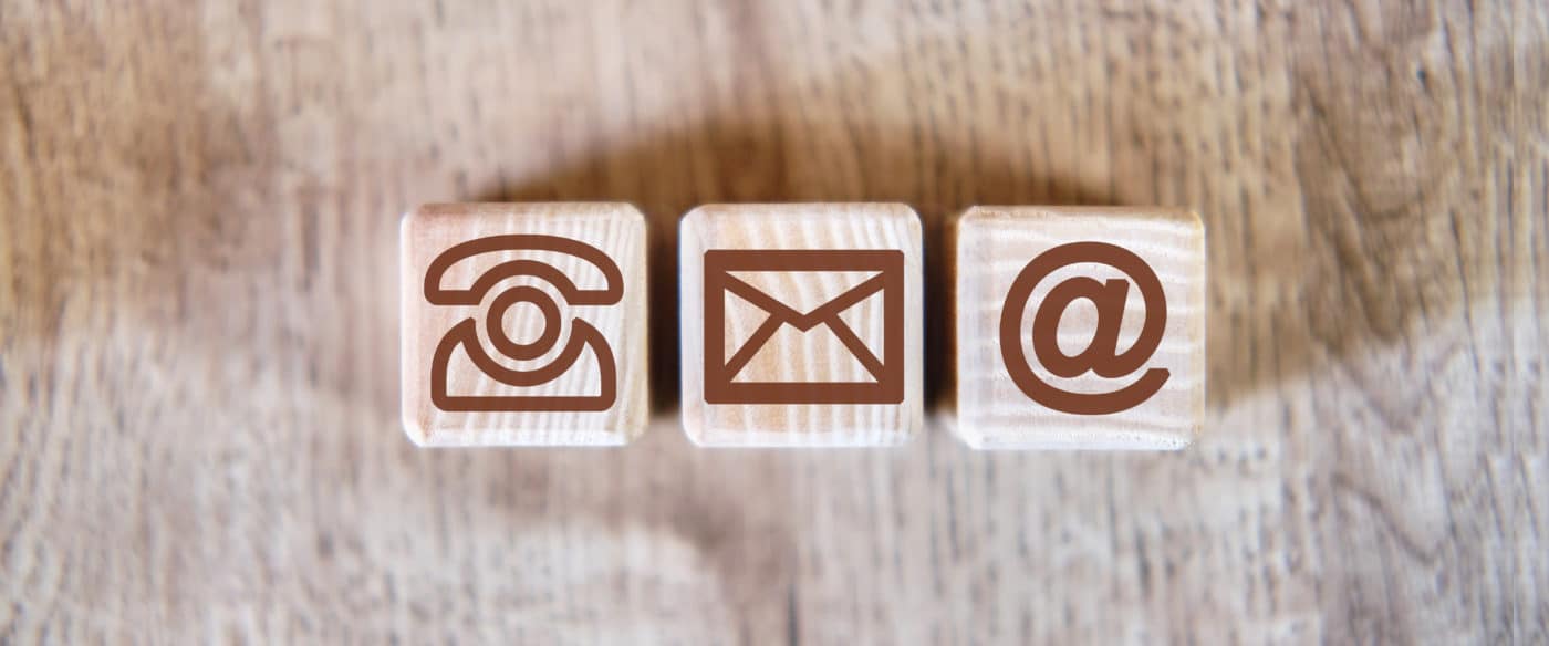 Contact Icons Letter Email Message Phone Concept on a wooden background